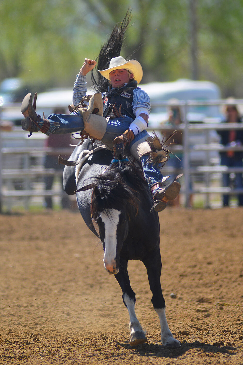 Roedy Farrell, from Thermopolis, rolls back as his horse kicks up